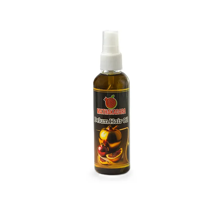 Mathakadara Delum Hair Oil bottle with pomegranate-inspired herbal haircare branding