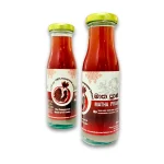 Two bottles of Mathakadara Matha Prana red pomegranate herbal beverage displayed together