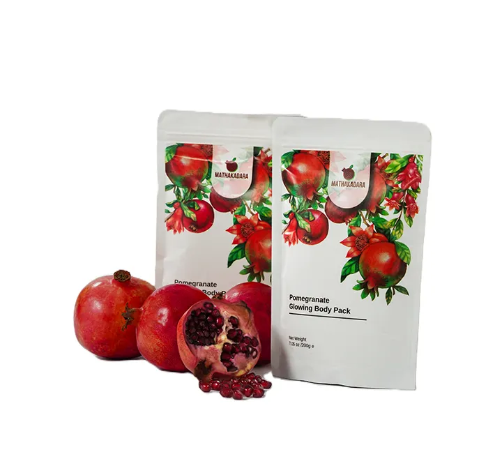 Mathakadara Pomegranate Glowing Body Pack herbal skincare product with fresh pomegranates displayed beside eco-friendly pouch packaging