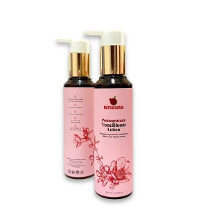 Mathakadara Pomegranate ToneBloom Lotion bottles with luxury pink skincare packaging designed for brightening and skin tone care